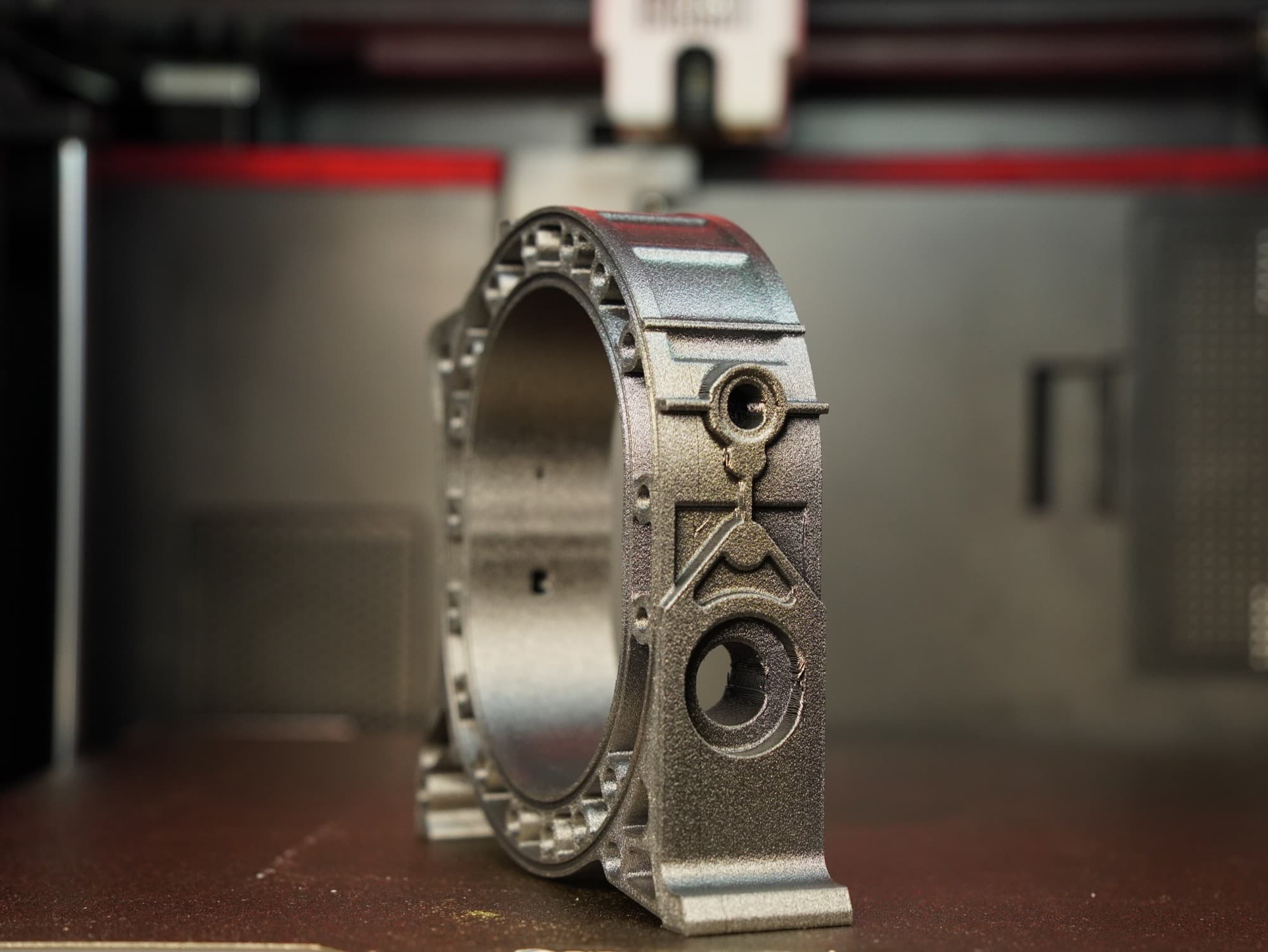 Metallic-finish 3D-printed rotary engine housing inside the print chamber